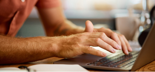 Person typing on laptop